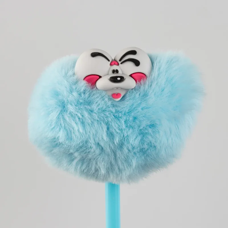 Stylo Pompon Diddl avec pompon bleu et tête de personnage souriant, accessoire amusant