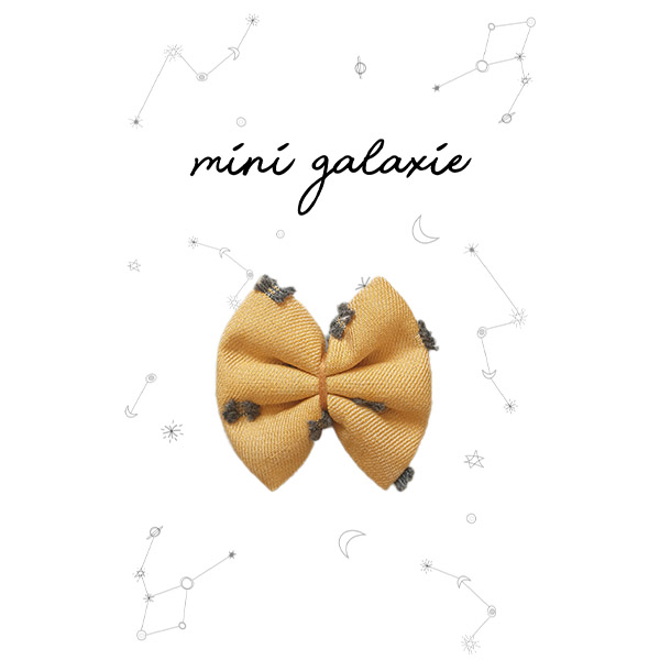 Barrette mini nœud ocre plumetis avec motifs délicats, accessoire élégant