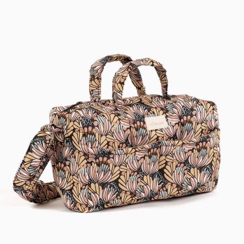 Sac à langer Fleurs d’eau - Minikane, motif floral, anses et bandoulière.