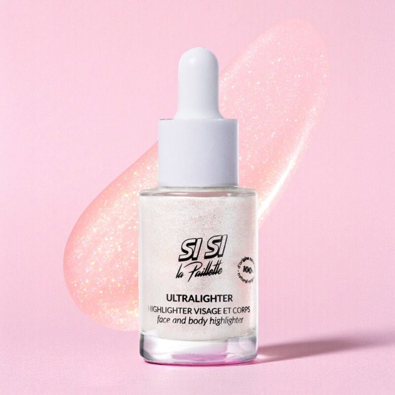 Ultralighter : enlumineur visage et corps dans un flacon avec pipette, fond rose.